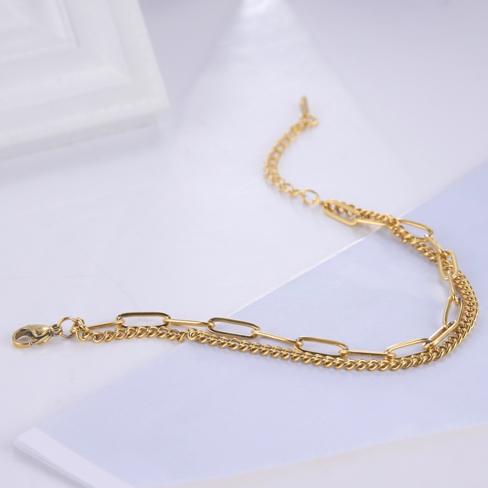 Dubbellaagse armband met kruis voor dames van titaniumstaal_voghion.com