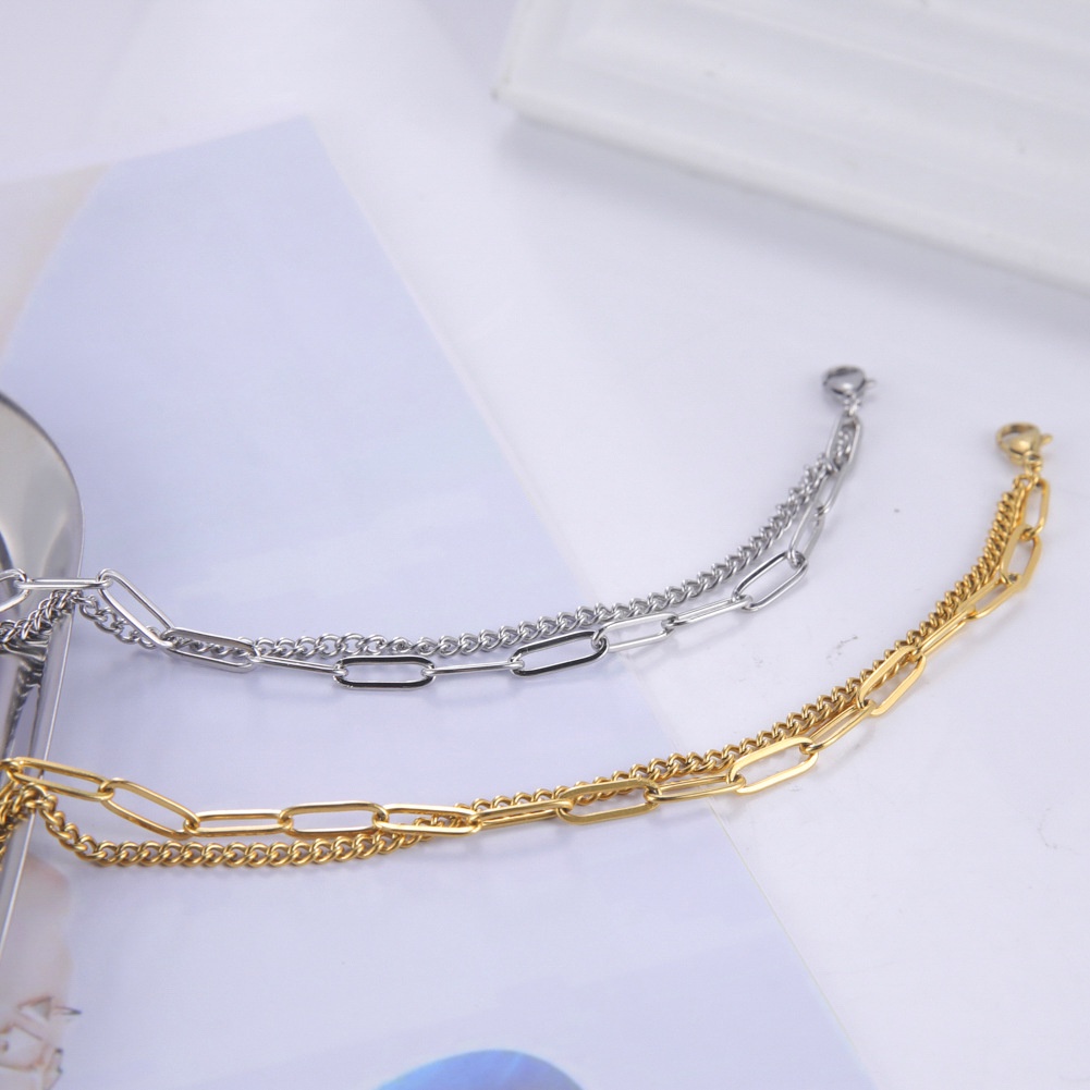 Dubbellaagse armband met kruis voor dames van titaniumstaal_voghion.com